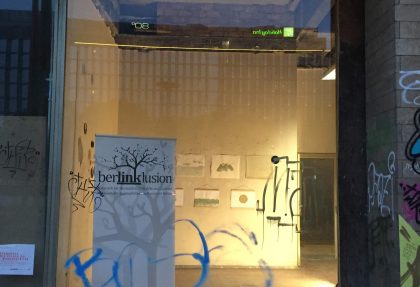 View through a showcase into the exhibition space.